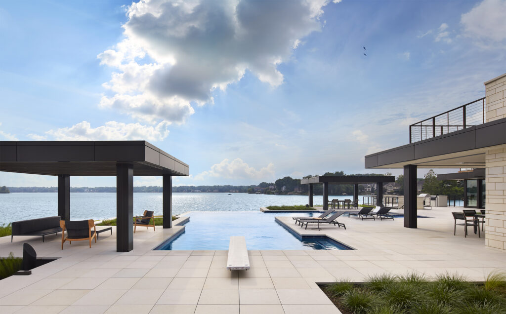 Image of a 2022 warm modern infinity pool by Charles R. Stinson Architecture and Design